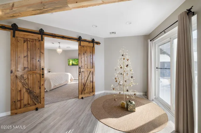 a living room with fireplace furniture and a wooden floor