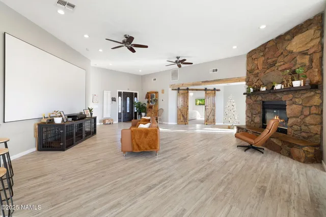 a kitchen with stainless steel appliances granite countertop a sink and cabinets