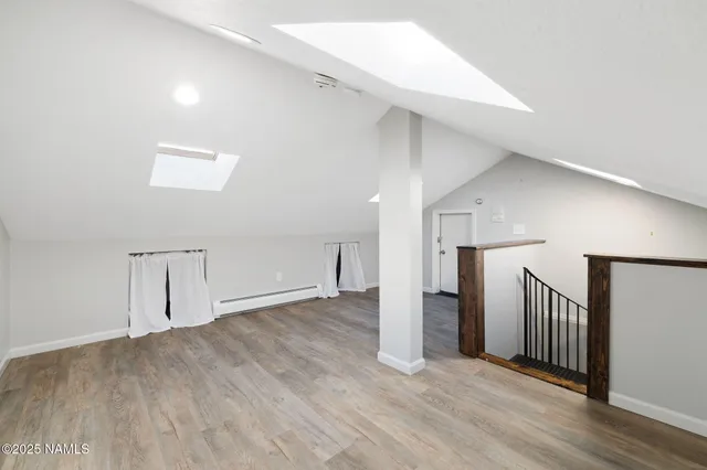 a view of a house with a street and a garage