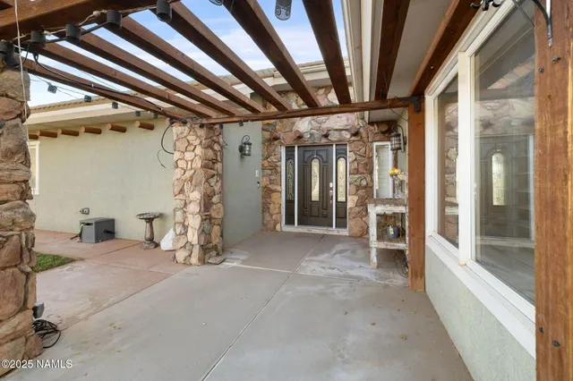 a front view of a house with a yard covered in snow