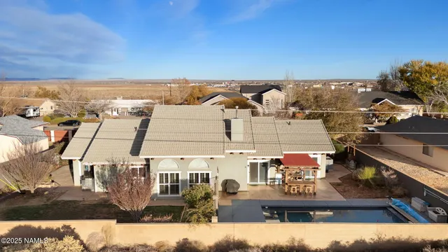 an aerial view of residential houses with outdoor space