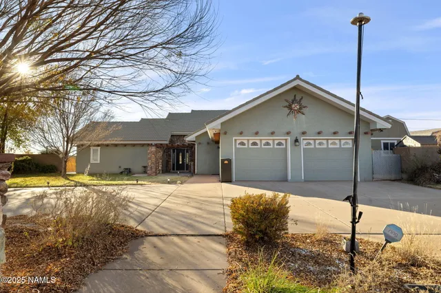 a view of a patio with a table and chairs