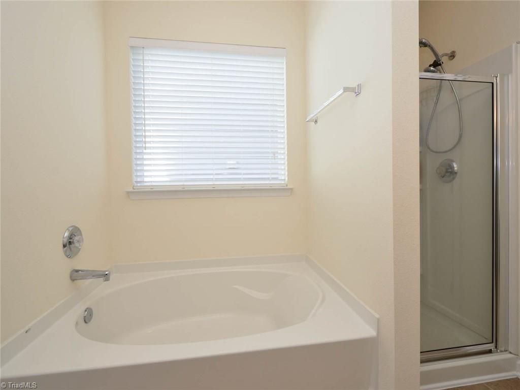 815 Hartley Hill Court High Point, NC 27265 - Photo 12 of 23 Garden tub in master bedroom bath with separate shower.