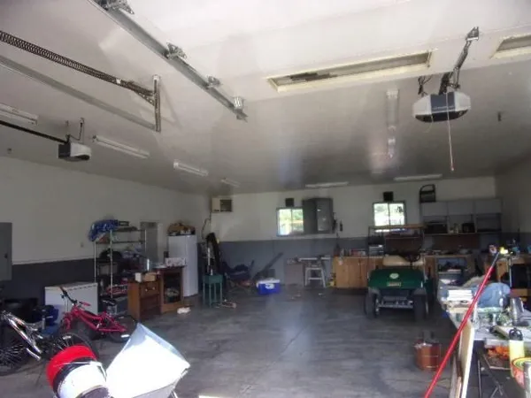 a living room with lots of furniture and a chandelier