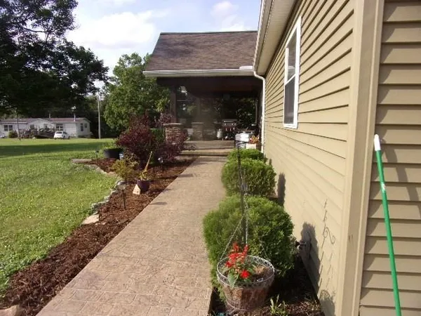 a view of a porch with potted plants