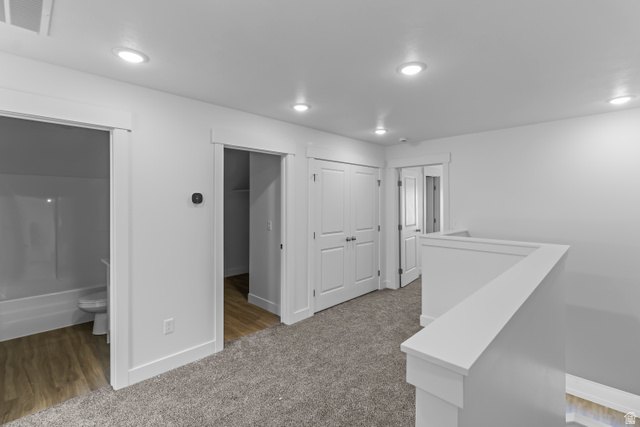 2995 South 265th Street West, Unit 752 Logan, UT 84321 - Photo 7 of 21 Carpeted hallway with white walls and recessed lighting