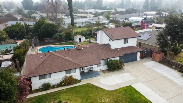 an aerial view of residential house with outdoor space