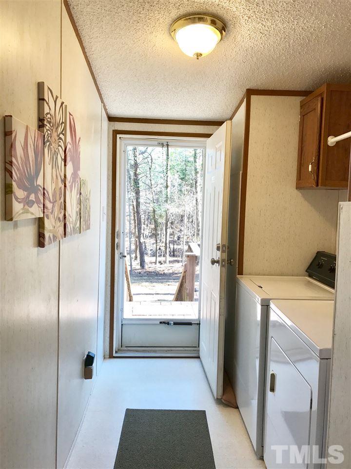 6916 Matthews Road Durham, NC 27712 - Photo 9 of 24 a bathroom with a bathtub and a shower