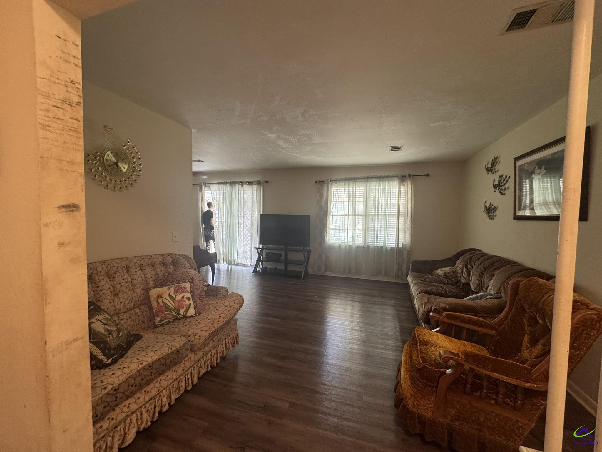 1032 Elberta Road Warner Robins, GA 31093 - Photo 19 of 26 a living room with furniture and wooden floor