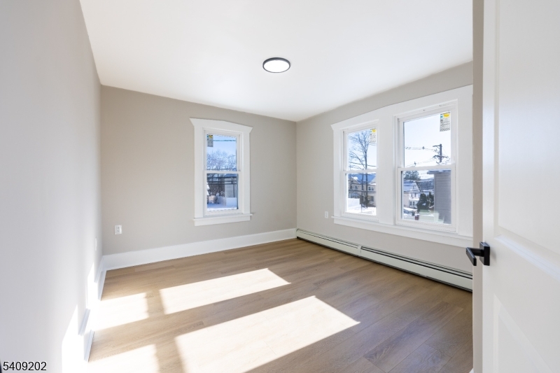 431 North Main Street Wharton, NJ 07885 - Photo 19 of 47 a view of an empty room with a window and wooden floor