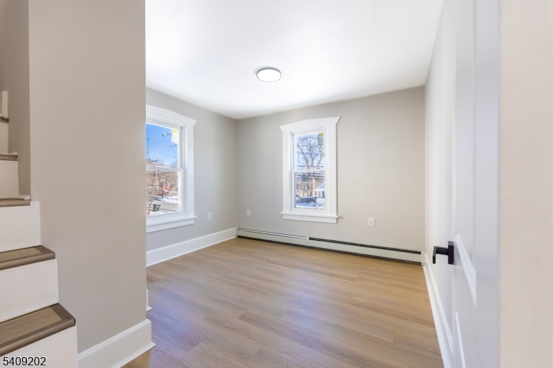 431 North Main Street Wharton, NJ 07885 - Photo 21 of 47 an empty room with wooden floor and windows