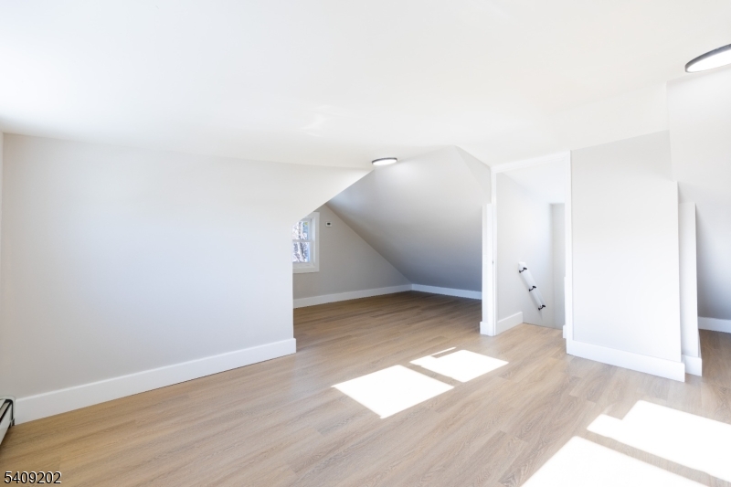 431 North Main Street Wharton, NJ 07885 - Photo 26 of 47 an empty room with wooden floor and windows