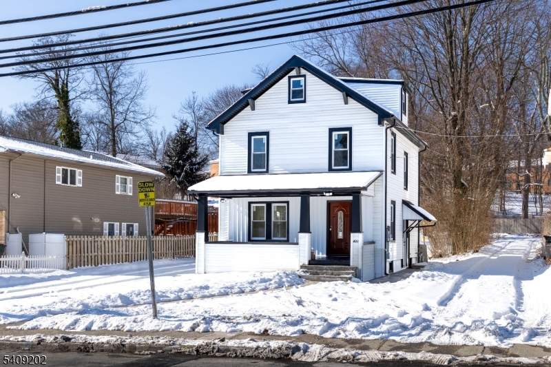 431 North Main Street Wharton, NJ 07885 - Photo 3 of 47 a front view of a house with a yard covered in snow