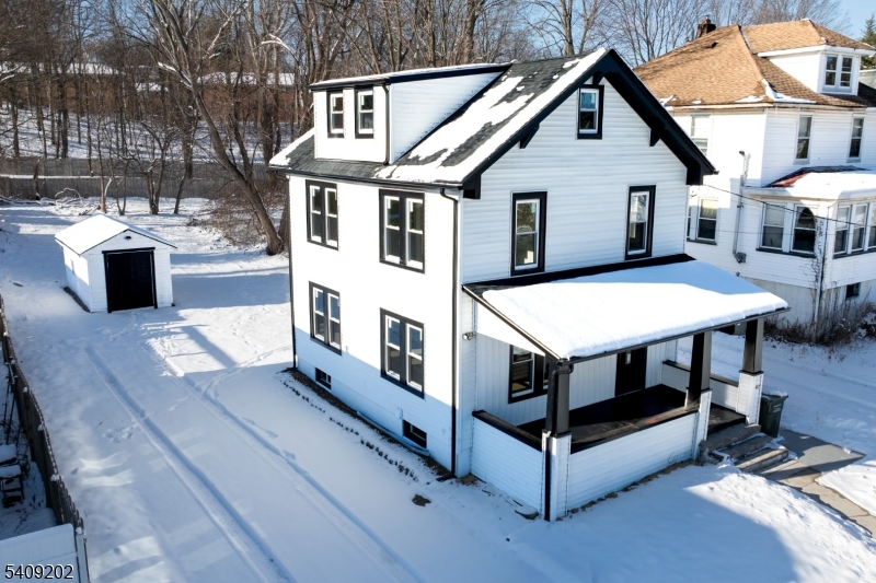 431 North Main Street Wharton, NJ 07885 - Photo 39 of 47 a view of a patio with table and chairs with wooden floor and fence