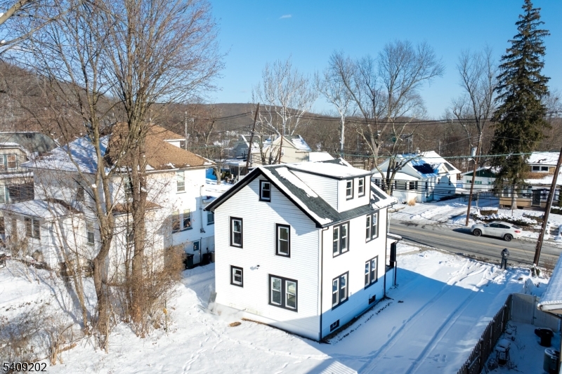 431 North Main Street Wharton, NJ 07885 - Photo 40 of 47 a view of a white house with a yard