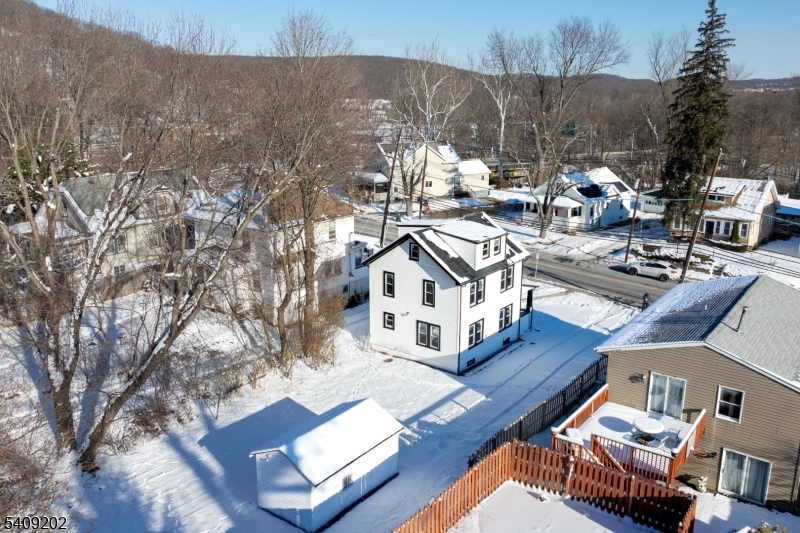 431 North Main Street Wharton, NJ 07885 - Photo 41 of 47 a view of a house with wooden deck and backyard