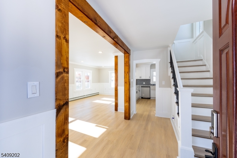 431 North Main Street Wharton, NJ 07885 - Photo 6 of 47 a view of a hallway with wooden floor and a living room