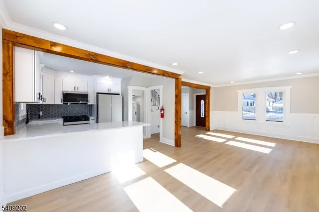 a view of a living room and kitchen