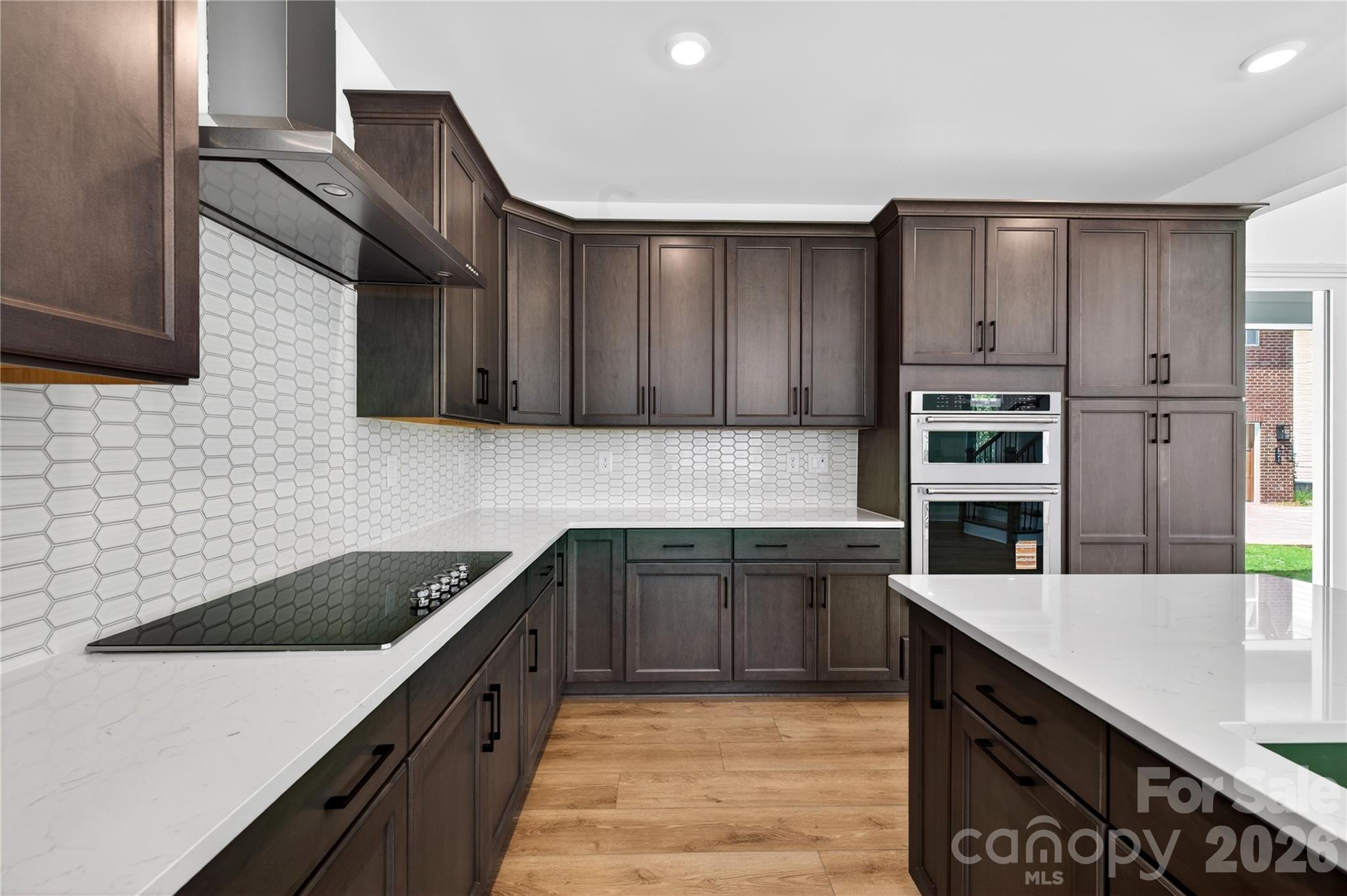 409 Celestial Drive Tega Cay, SC 29708 - Photo 4 of 10 a kitchen with stainless steel appliances granite countertop a sink stove and refrigerator