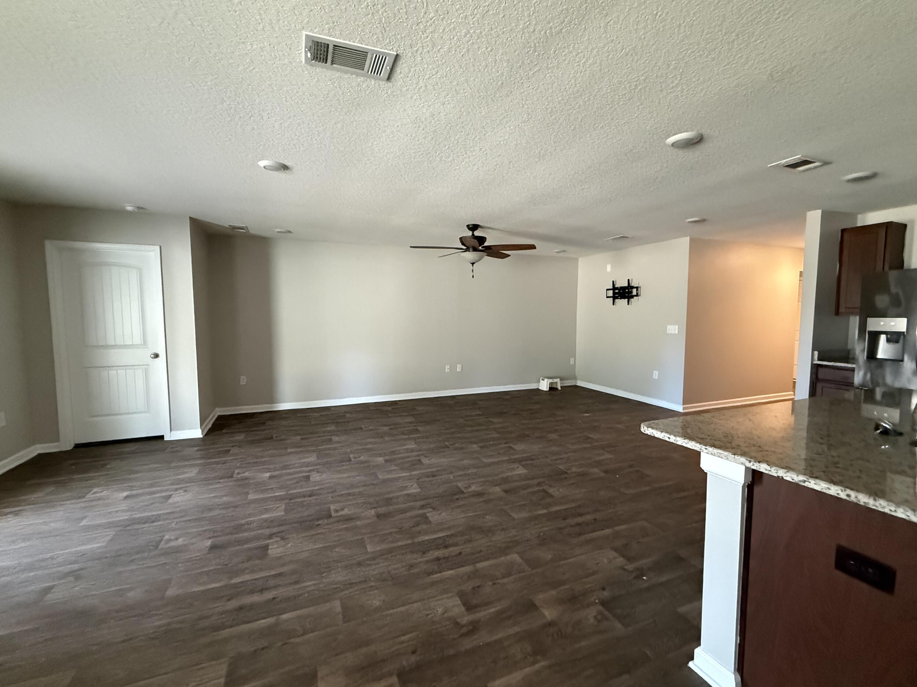 1004 Limpkin Street Crestview, FL 32539 - Photo 12 of 31 an empty room with a natural light