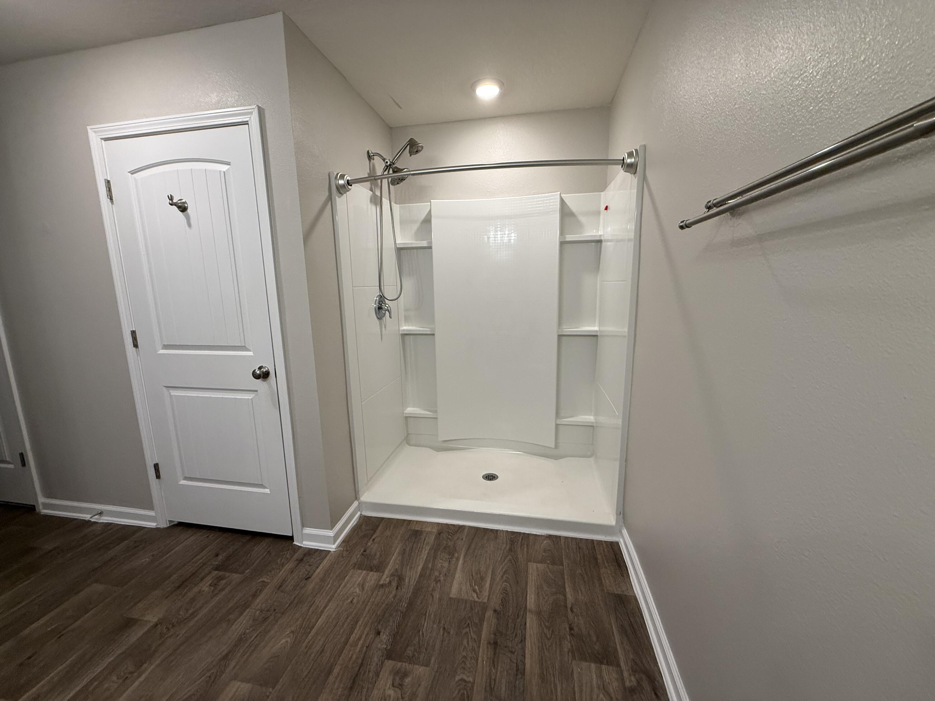 1004 Limpkin Street Crestview, FL 32539 - Photo 26 of 31 a bathroom with a shower and a toilet