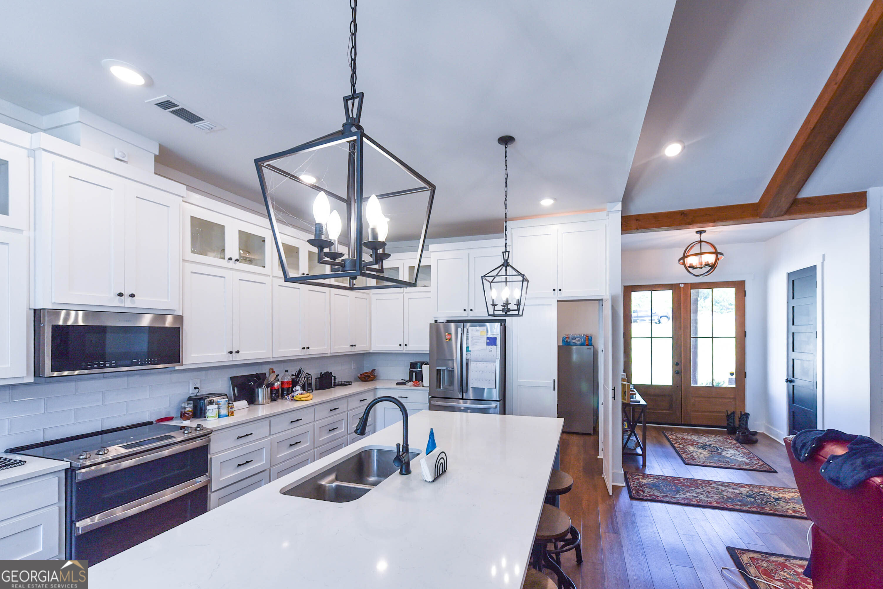 209 Lee Road Salem, AL 36874 - Photo 11 of 37 a kitchen with granite countertop a sink a counter space appliances and cabinets