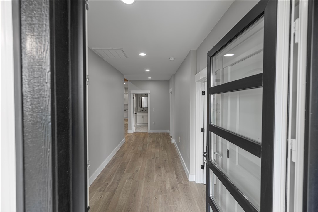 2817 Broadway Lake Road Anderson, SC 29621 - Photo 17 of 41 A well-lit entry hall with recessed lighting and natural wood-look flooring invites exploration into the home's interior.
