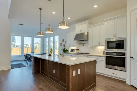 a view of front door with wooden floor