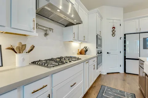 a bathroom with a sink and a large mirror