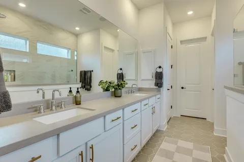 a view of a bathroom with a sink and mirror