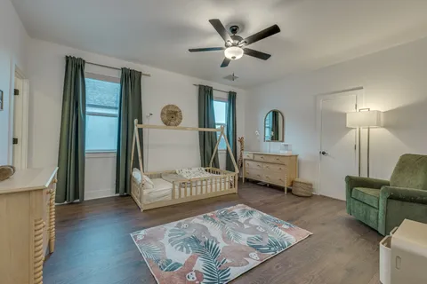a bathroom with a sink a toilet and shower curtain