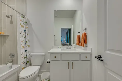 a room with table and flowerpot