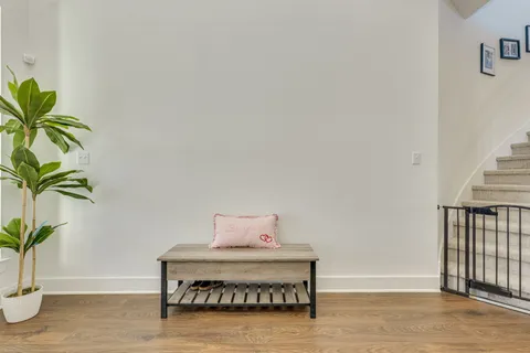 a bed sitting in a bedroom next to a window