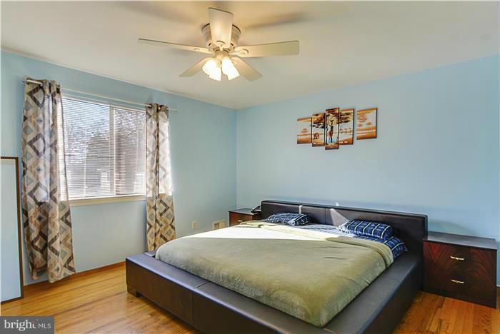 1307 Gresham Road Silver Spring, MD 20904 - Photo 13 of 22 a bed sitting in a bedroom next to a window