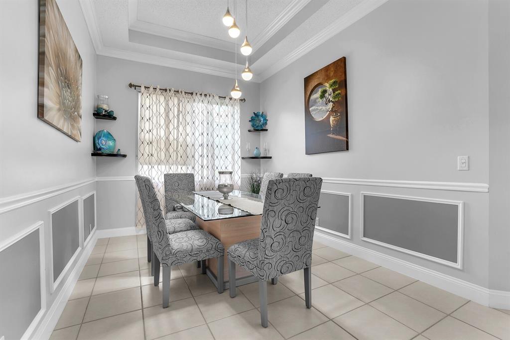 7955 Rockford Road Boynton Beach, FL 33472 - Photo 12 of 22 a dining room with furniture and window