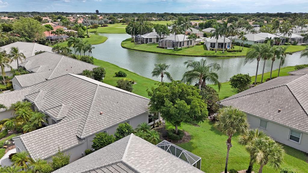 7955 Rockford Road Boynton Beach, FL 33472 - Photo 14 of 22 an aerial view of a house with a garden and lake view