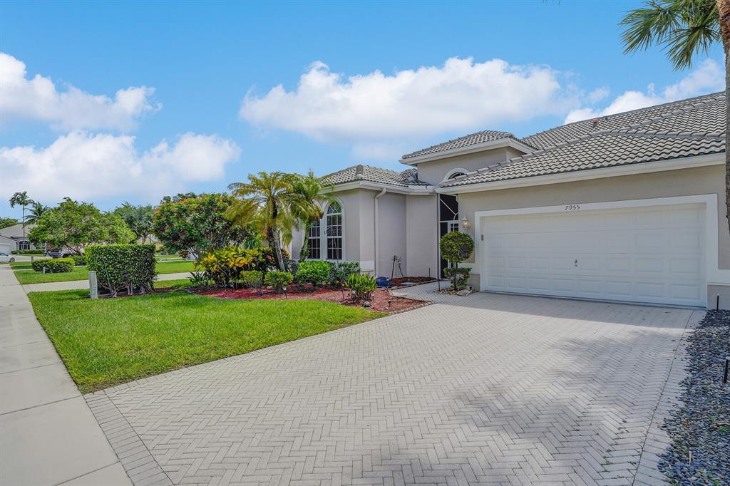 7955 Rockford Road Boynton Beach, FL 33472 - Photo 21 of 22 a view of a house with a garden