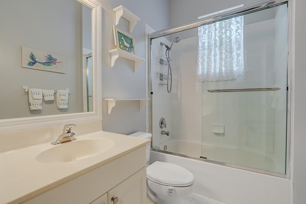 7955 Rockford Road Boynton Beach, FL 33472 - Photo 5 of 22 a bathroom with a sink a toilet and shower