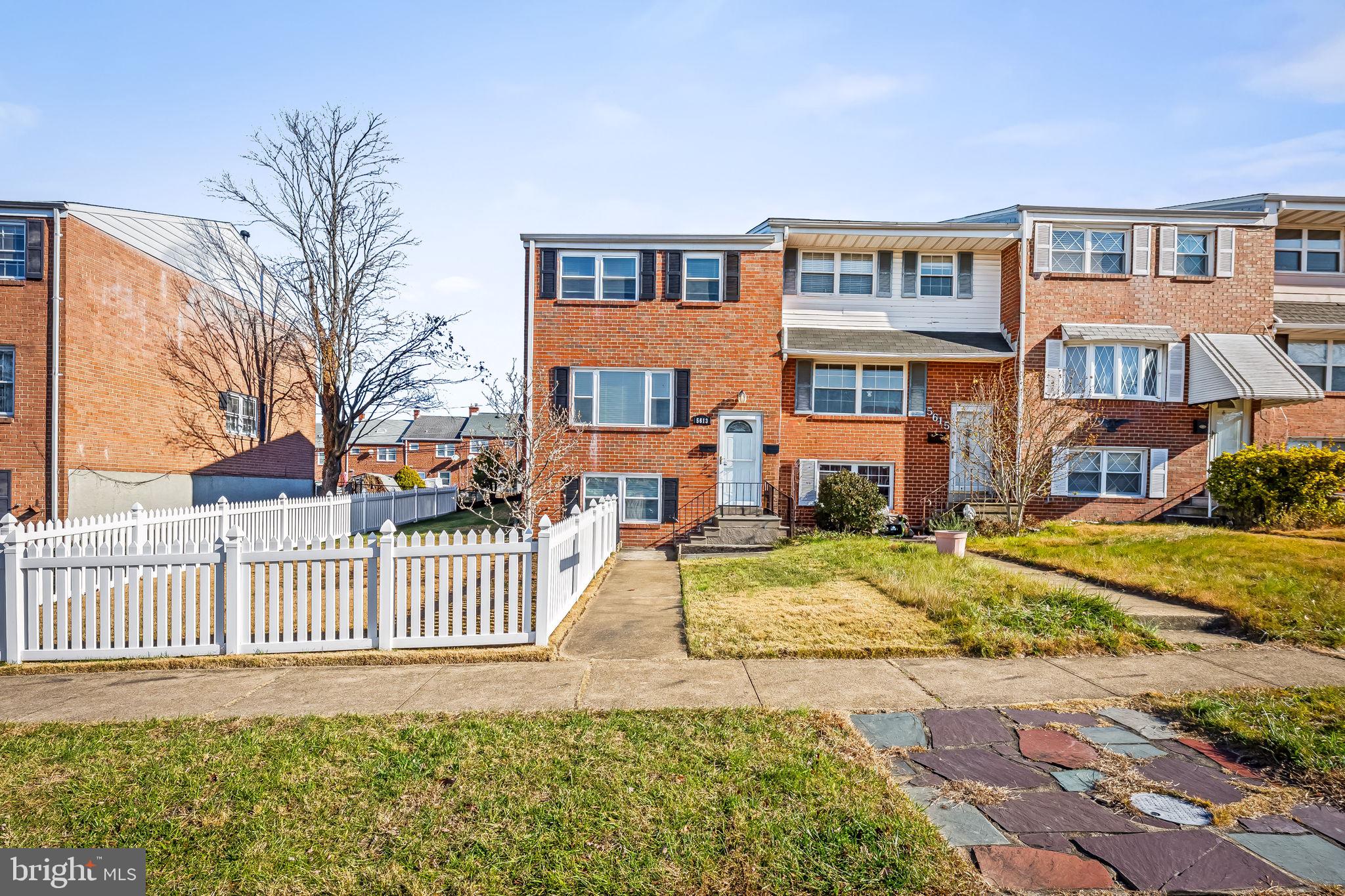5613 Chelwynd Road Baltimore, MD 21227 - Photo 1 of 38 a front view of a house with a yard