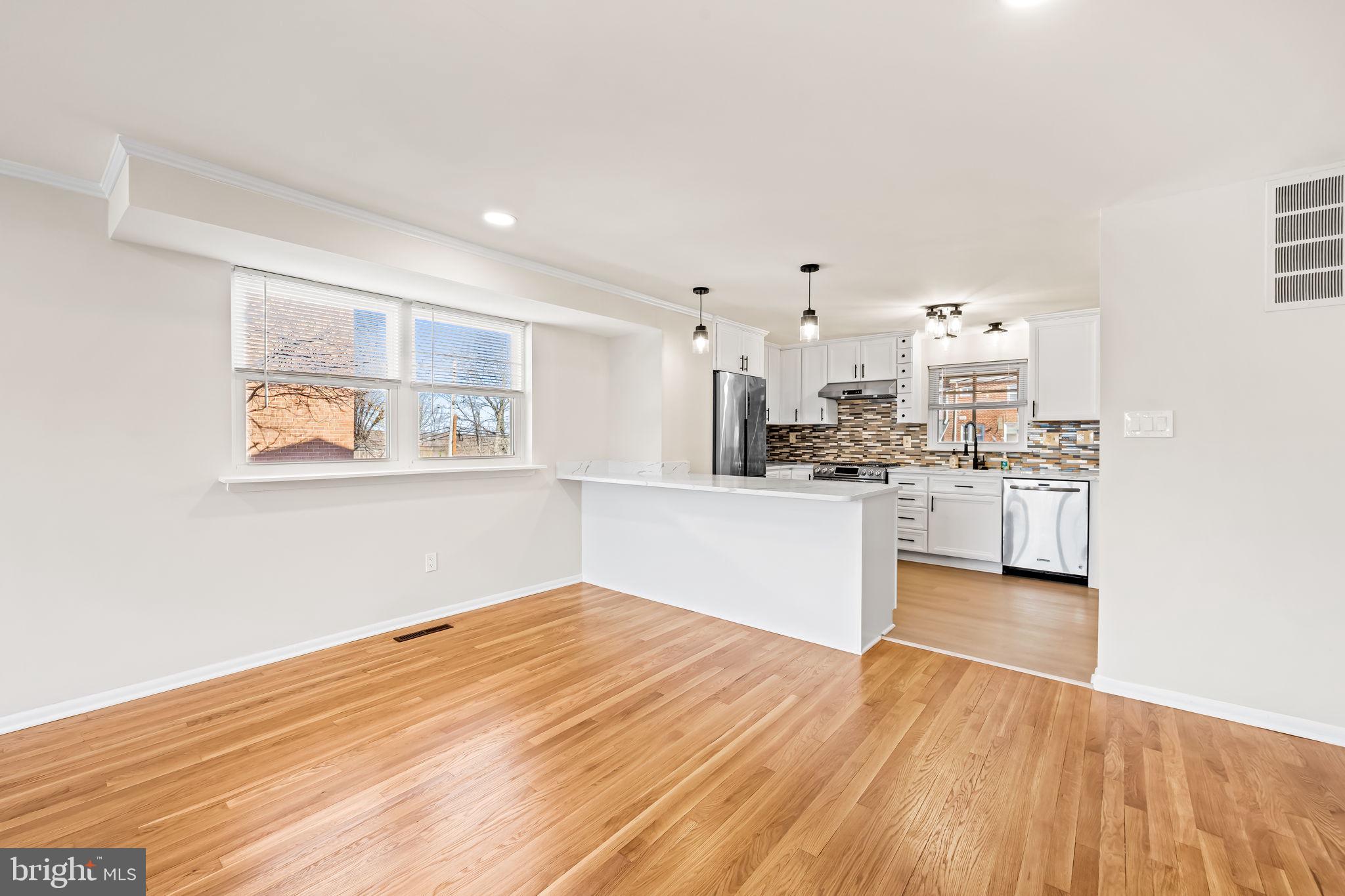5613 Chelwynd Road Baltimore, MD 21227 - Photo 8 of 38 a view of a kitchen with wooden floor