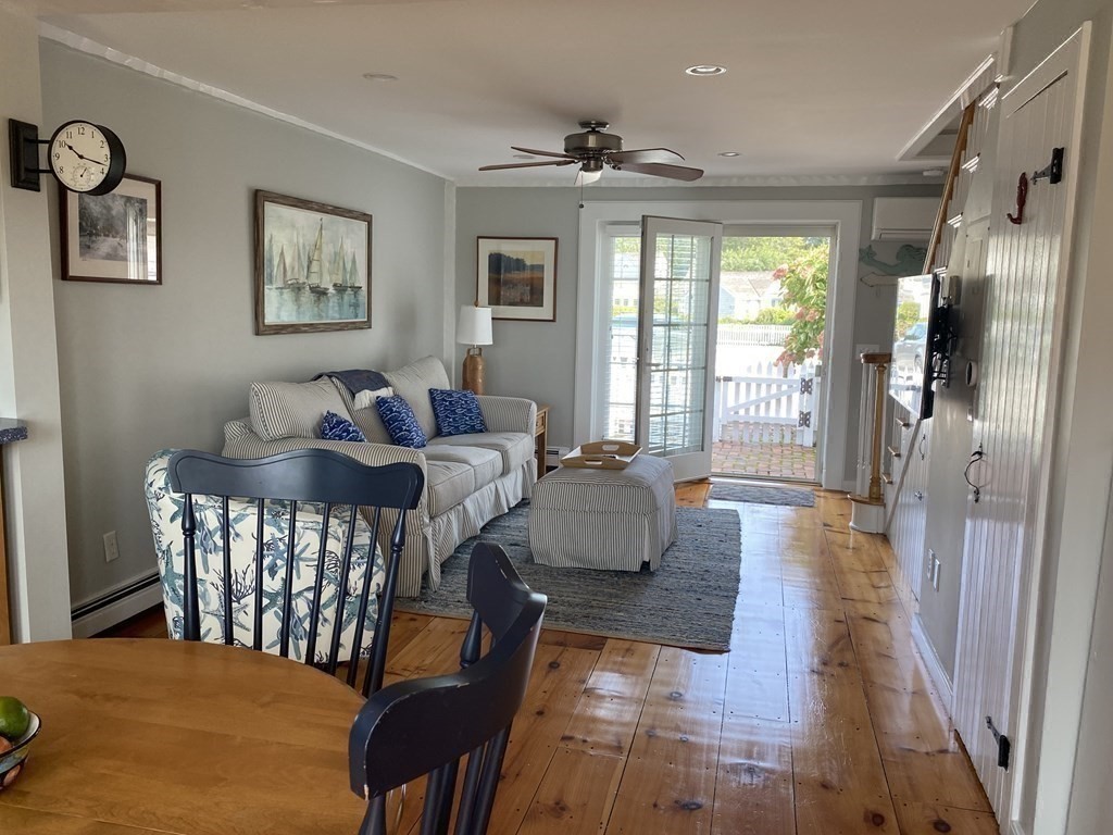 4 Race Point Road, Unit 4 Mashpee, MA 02649 - Photo 12 of 34 a living room with furniture and a table