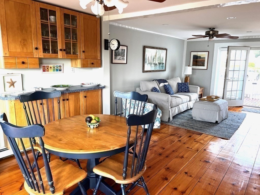 4 Race Point Road, Unit 4 Mashpee, MA 02649 - Photo 14 of 34 a outdoor dining space with furniture and wooden floor