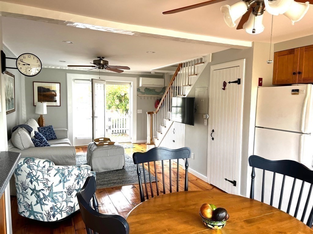 4 Race Point Road, Unit 4 Mashpee, MA 02649 - Photo 18 of 34 a living room with furniture fireplace and a window