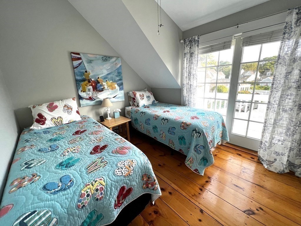 4 Race Point Road, Unit 4 Mashpee, MA 02649 - Photo 29 of 34 a bedroom with two beds and a window
