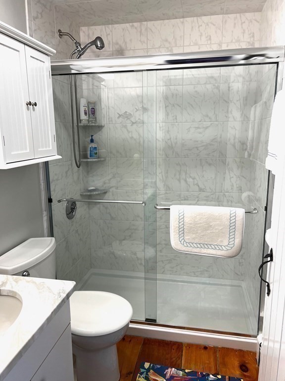 4 Race Point Road, Unit 4 Mashpee, MA 02649 - Photo 32 of 34 a bathroom with a sink a toilet and shower