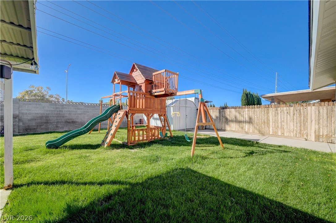 1331 Pinto Road Boulder City, NV 89005 - Photo 37 of 46 A spacious, well-kept lawn provides an ideal setting for outdoor recreation with a large playset.
