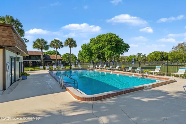 a view of outdoor space swimming pool and outdoor seating
