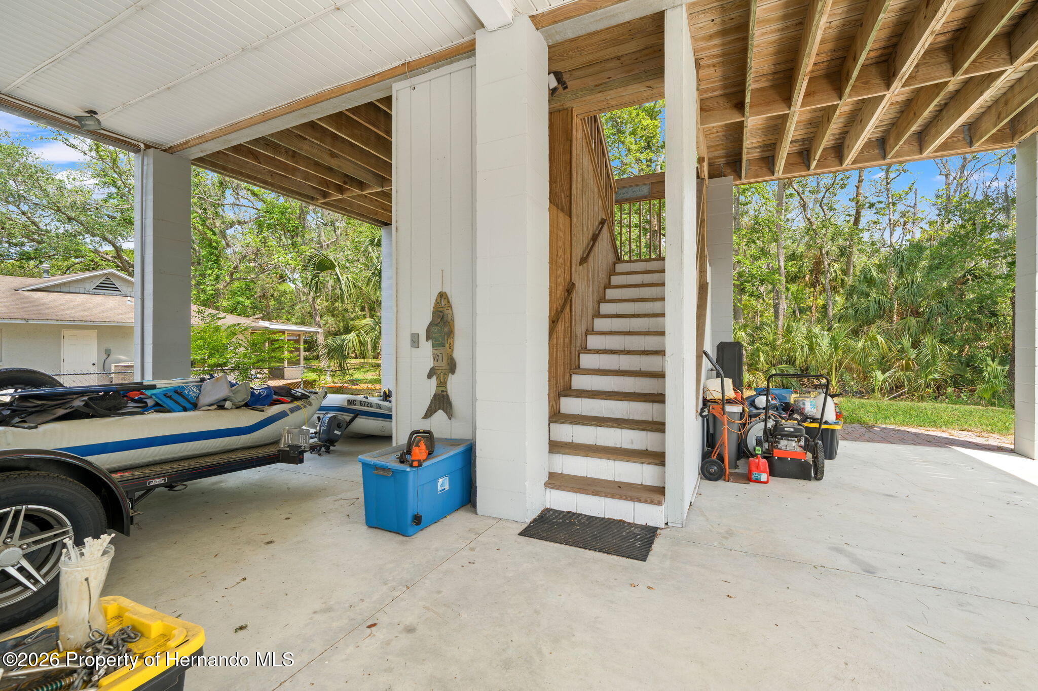 1566 Indian Bay Road Spring Hill, FL 34607 - Photo 46 of 56 a view of a chairs and table in a patio