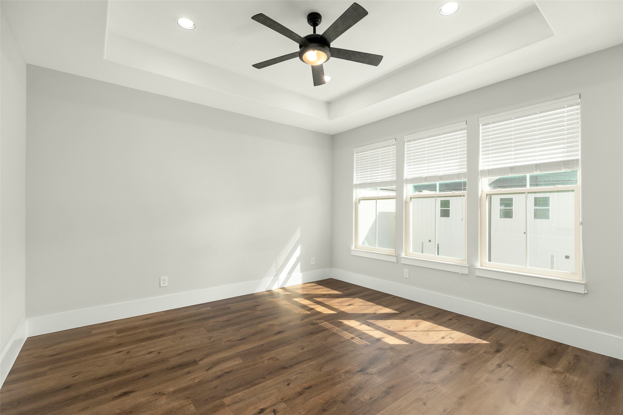 1421 West 23rd Street, Unit C Houston, TX 77008 - Photo 17 of 40 an empty room with wooden floor and windows