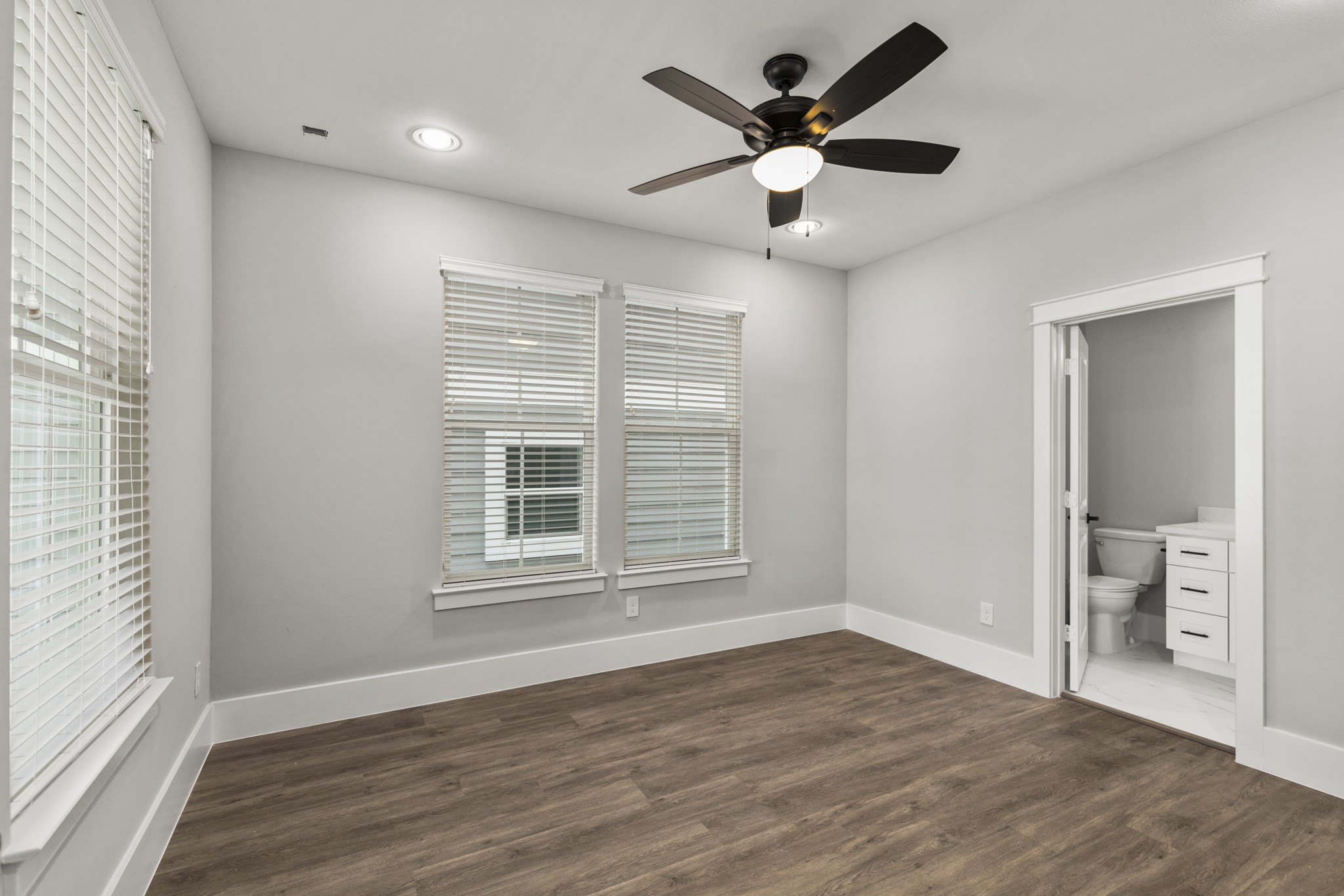 1421 West 23rd Street, Unit C Houston, TX 77008 - Photo 24 of 40 a view of an empty room with a window and wooden floor